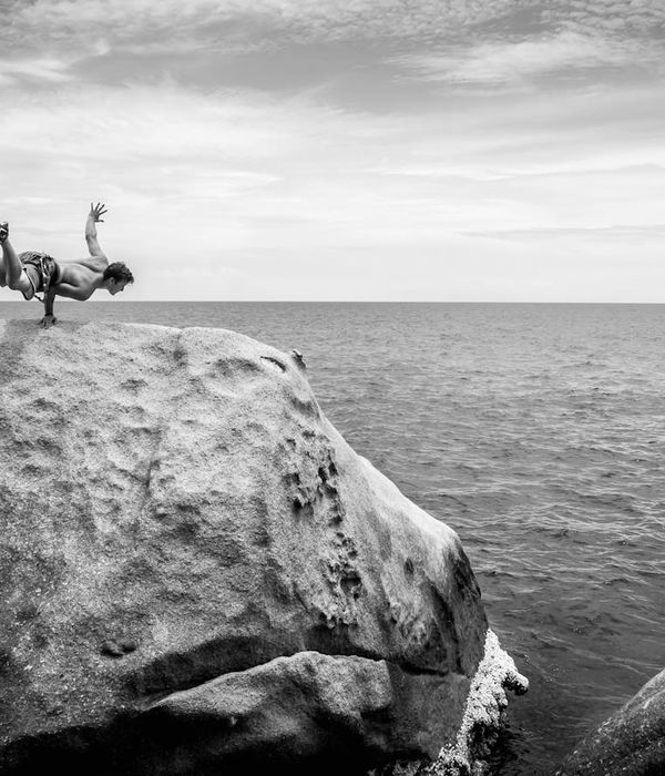 Man performing a controlled strength exercise in a calm environment.